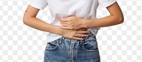 Person in a white T-shirt and jeans clutching their stomach with both hands, suggesting abdominal pain.